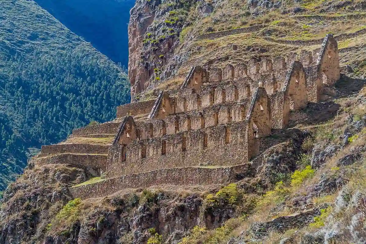 Ancient Ollantaytambo ruins against lush Sacred Valley, visited during Yacht Isabela II Peru tour.