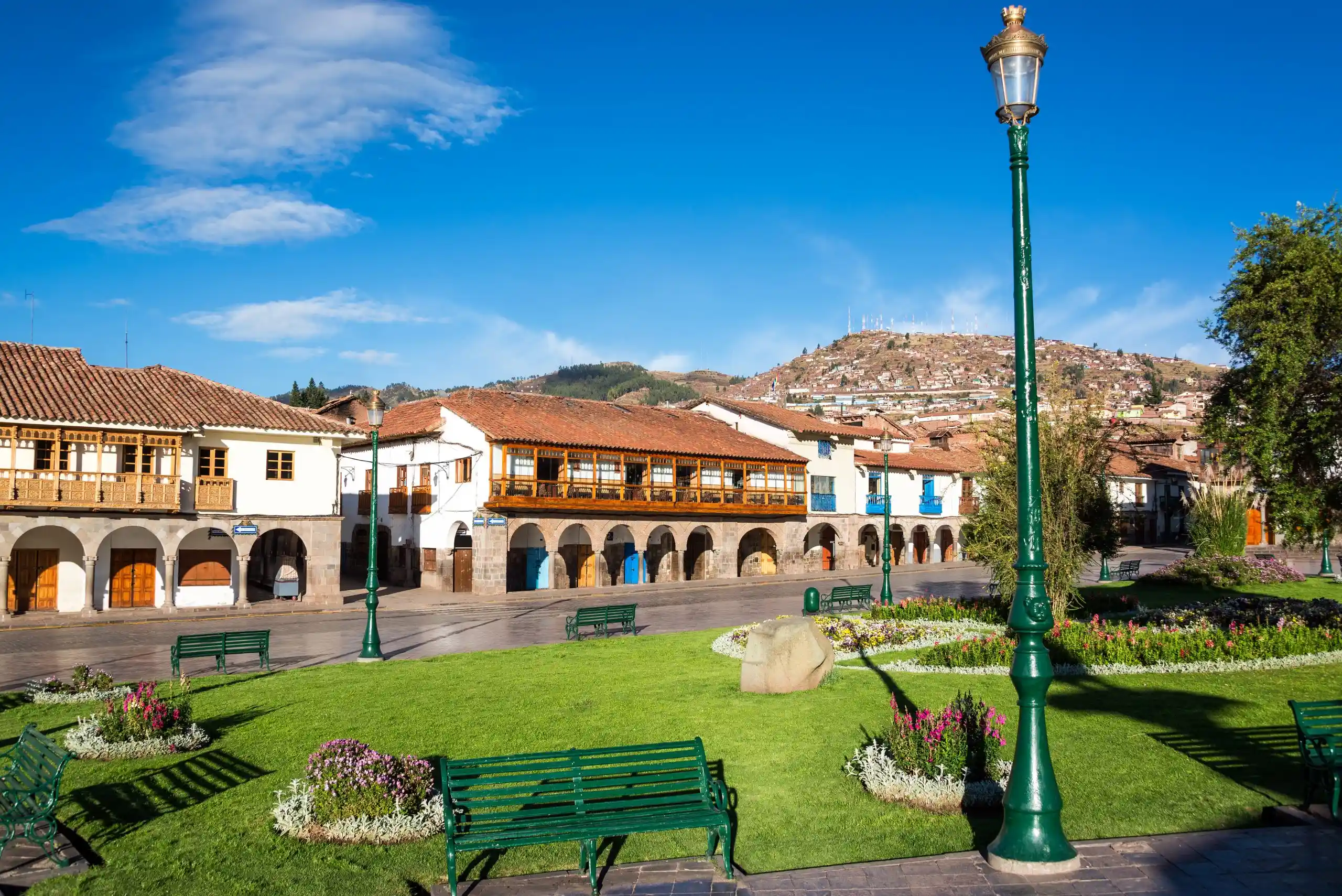 Plaza de Armas, Cusco, Peru with clear blue skies on Yacht Isabela II's exclusive tour.
